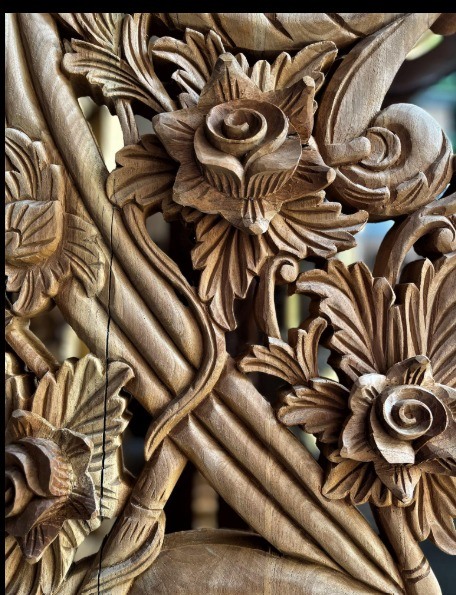 Roses carved in relief, finished by hand